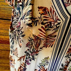 Ruffled sleeveless V neck Blouse